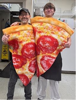 pizza palace staff dressed in pepperoni slice costumes