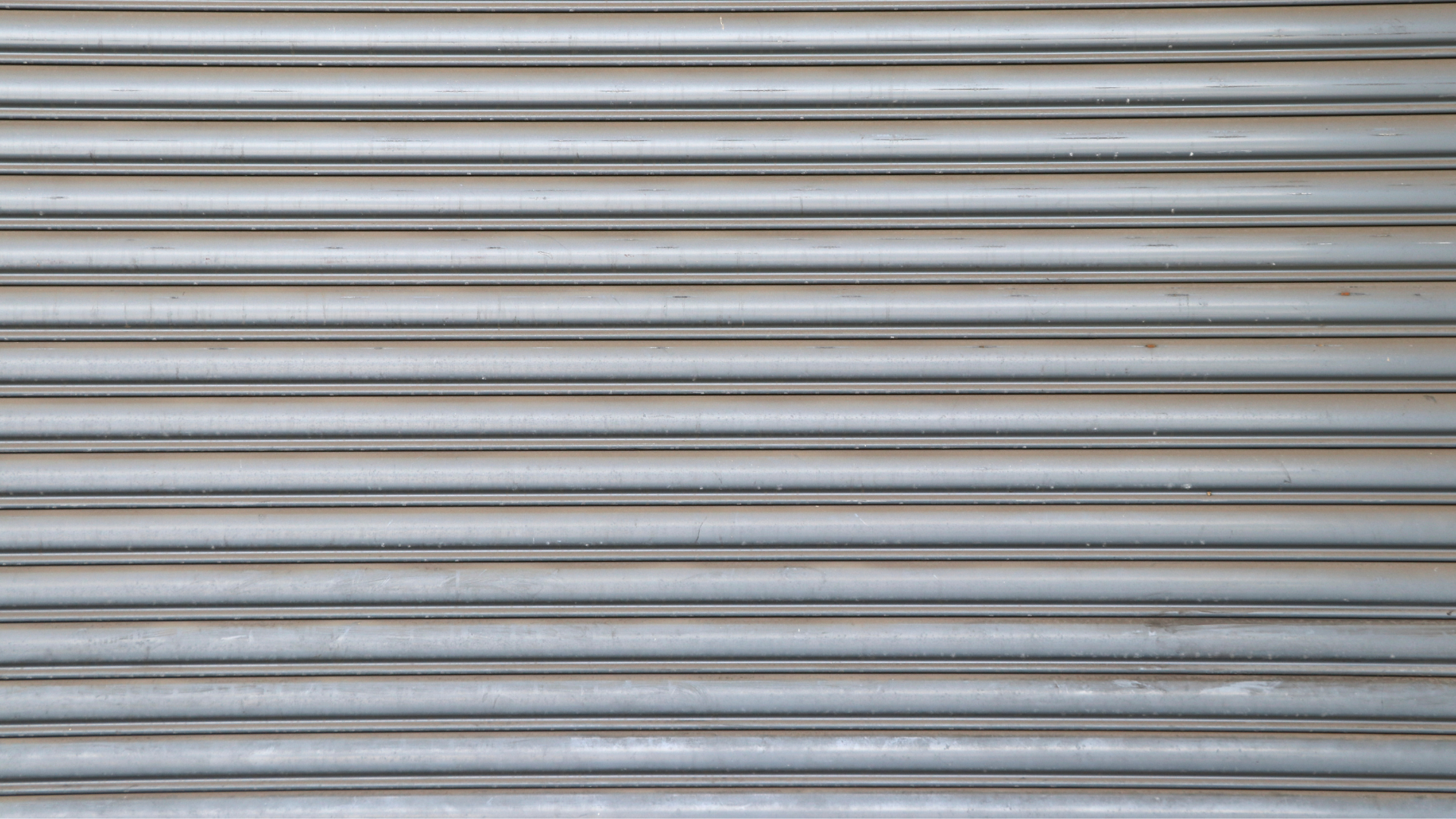 A close up of a roll up garage door.canv