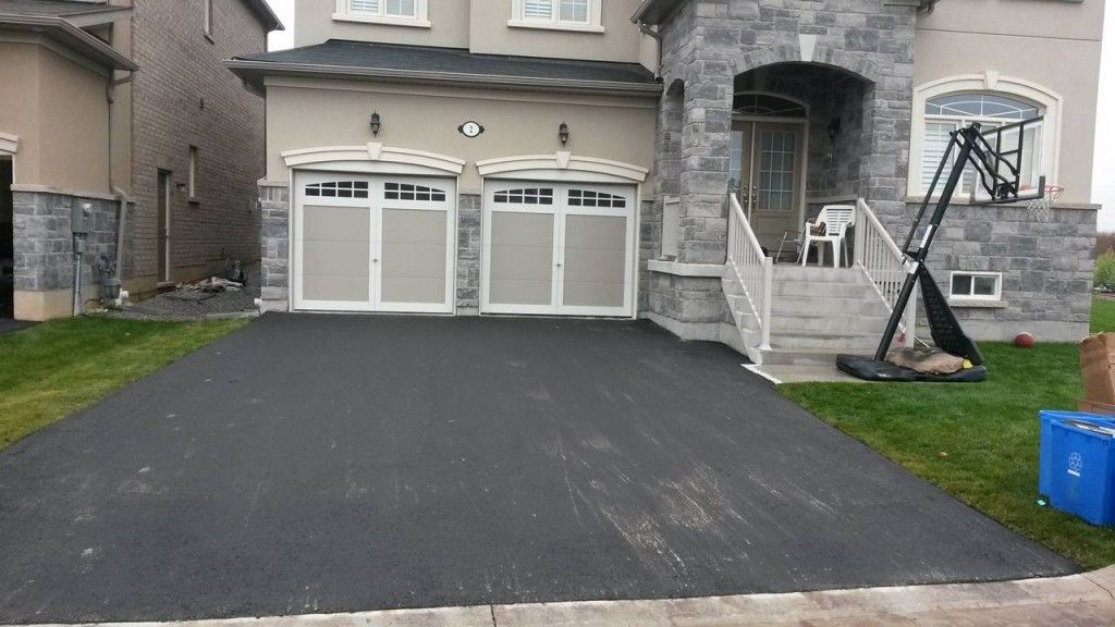 A house with a basketball hoop in front of it