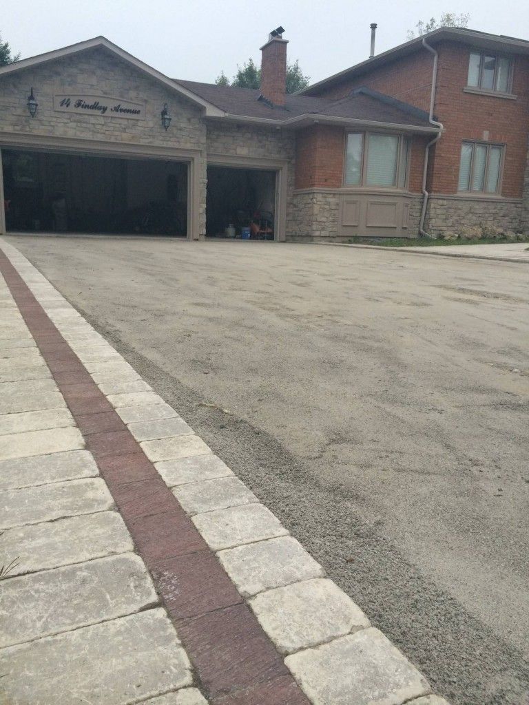 A large house with a garage and a driveway