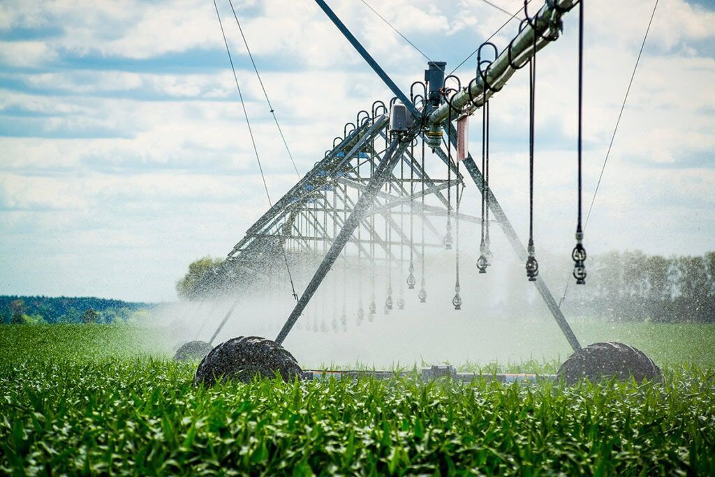 An Irrigation System Spraying Water on a Field — Pumps Sales & Repairs in Albury, NSW