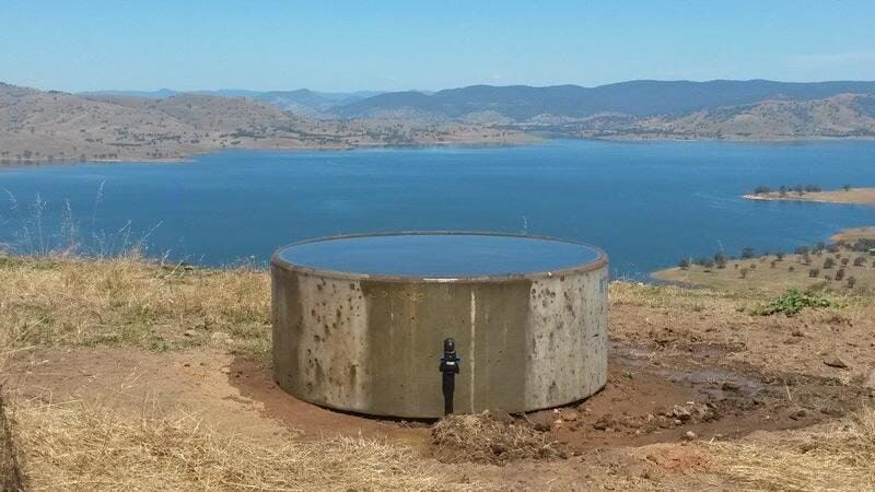 A Concrete Tank With Water — Pumps Sales & Repairs in Albury, NSW