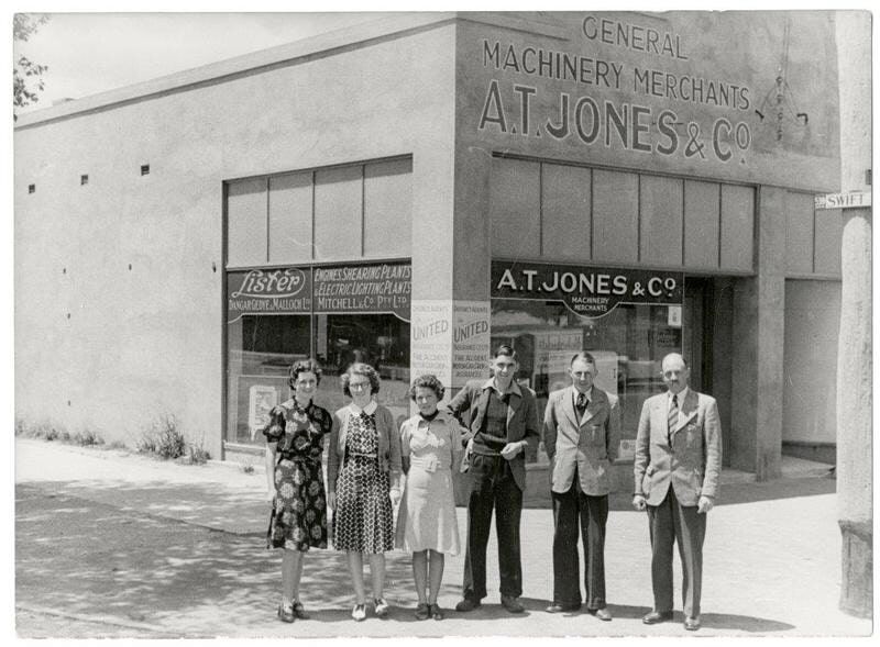 A Group of People Standing in Front of a Store — Pumps Sales & Repairs in Albury, NSW