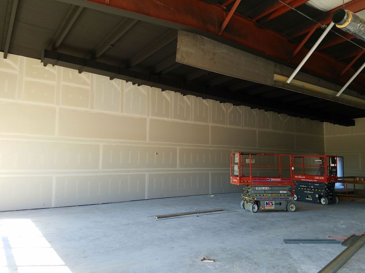 Bethune Painting's services include drywall installation, hanging and finishing Sheetrock to a level five finish.