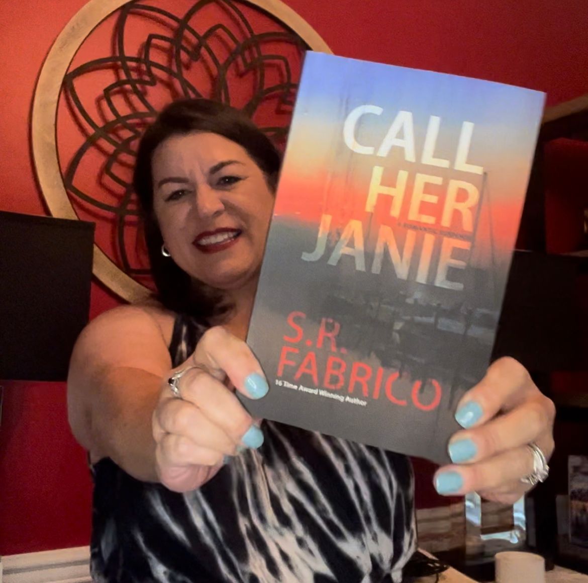 A woman is holding a book titled call her janie