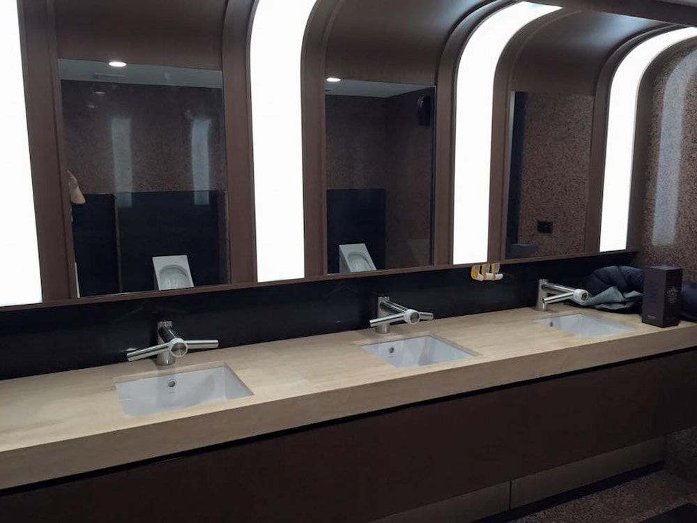 Public Restroom With Three Sinks and Mirrors — Unique Waterproofing Solutions in North Rocks, NSW