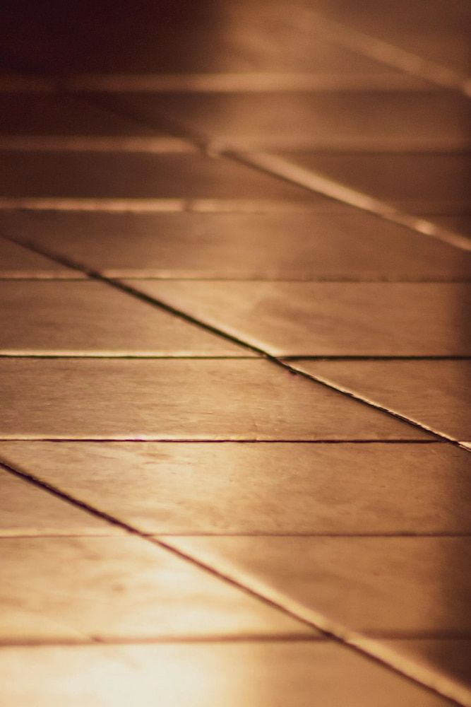 Wooden Planks, Lit With Warm Light, Forming a Floor, With Angled Lines — Unique Waterproofing Solutions in North Rocks, NSW