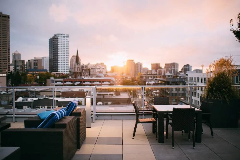 Rooftop Patio Overlooking a Cityscape at Sunset — Unique Waterproofing Solutions in North Rocks, NSW