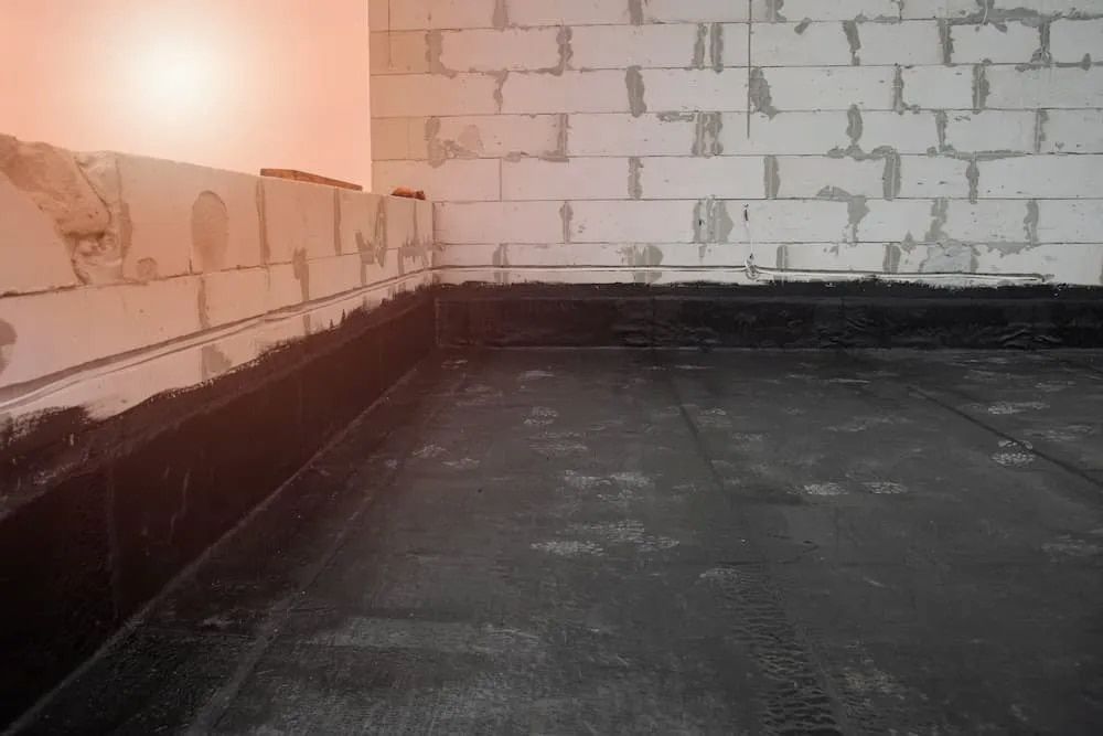 Featuring Black Waterproof Membrane and Brick Walls — Unique Waterproofing Solutions in North Rocks, NSW