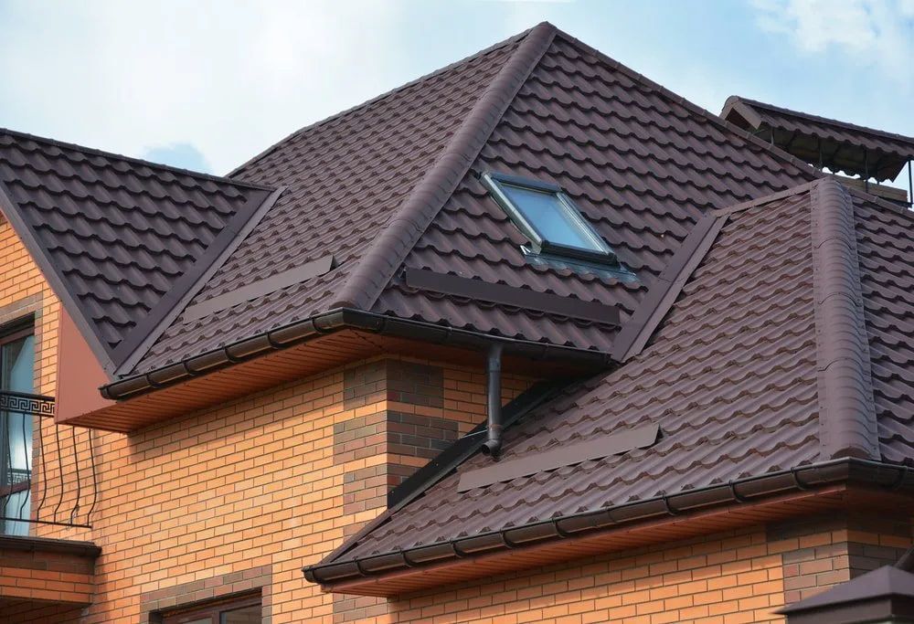 Brown Metal Roof on a Brick Building, With a Skylight — Unique Waterproofing Solutions in North Rocks, NSW