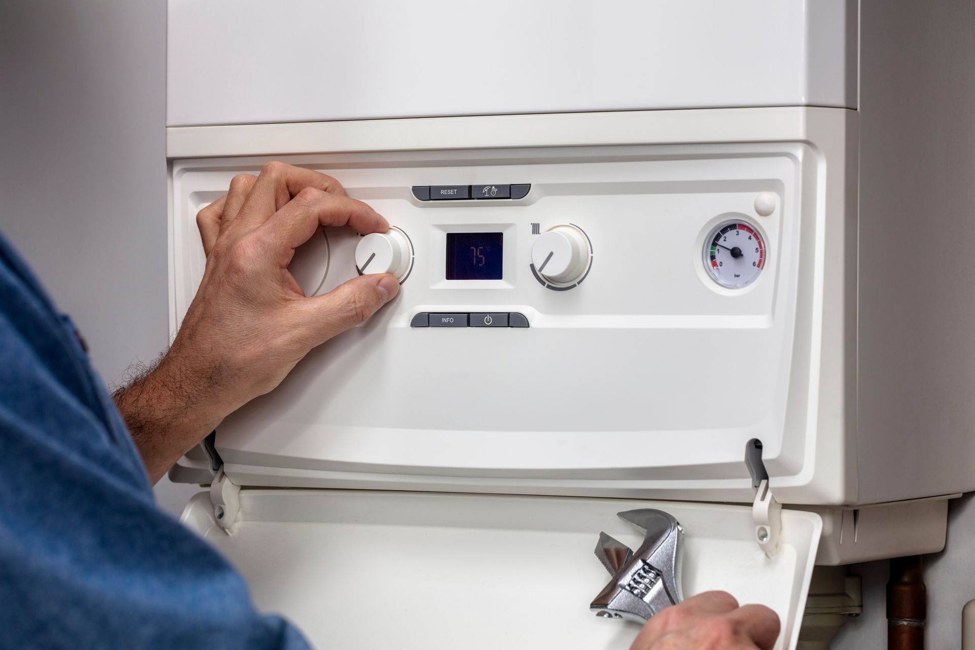 HVAC technician performing boiler maintenance and inspection in Endicott, New York.