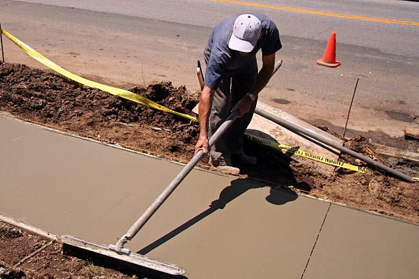 worker crouching on the cement