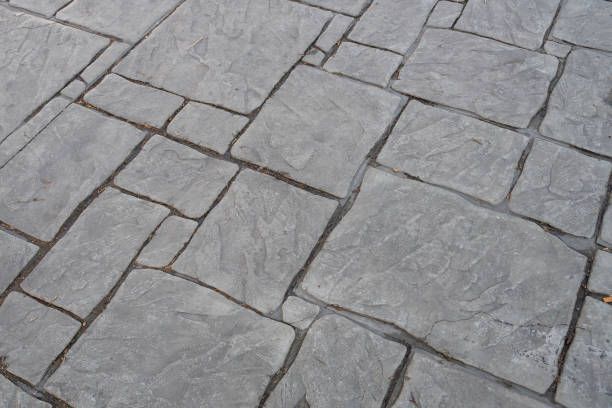 worker crouching on the cement