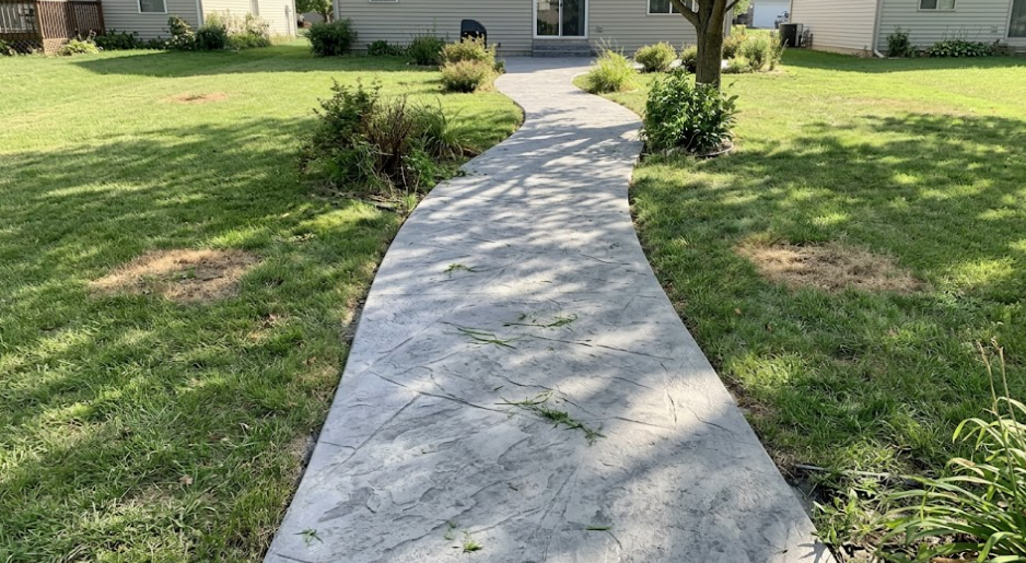 A beautiful, newly installed concrete walkway to a home in Summerville, SC.