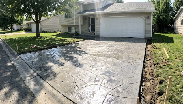 A newly finished stamped concrete driveway by Pro Concrete Summerville.