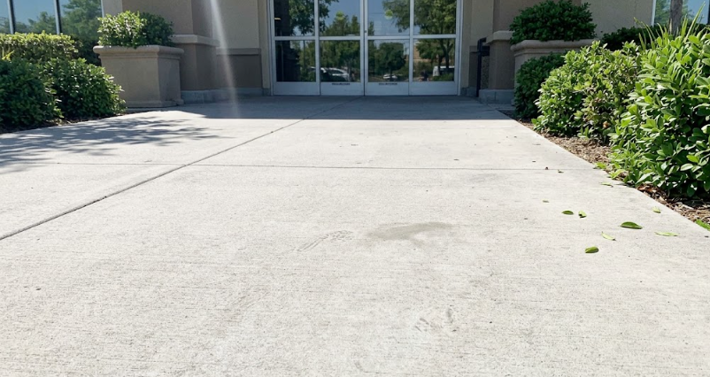 Safe and smooth concrete sidewalk flatwork leading to a local business entrance