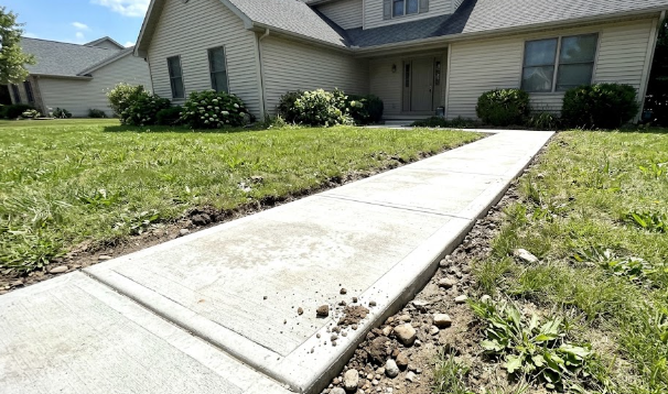 A freshly poured concrete sidewalk leading to a beautiful house in Summerville SC.