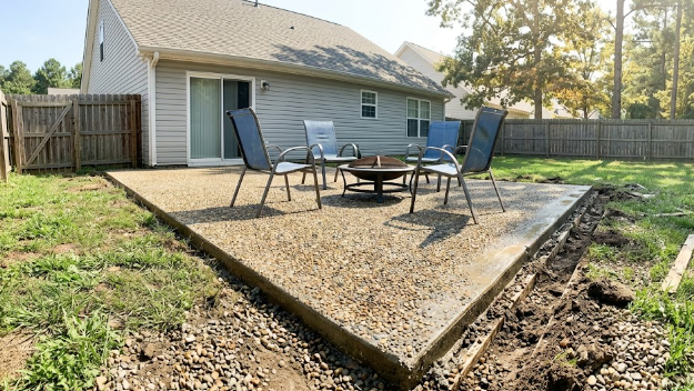 An exposed aggregate concrete patio perfect for outdoor entertaining in Summerville.