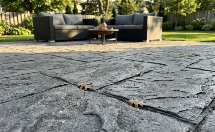 Beautiful stamped decorative concrete patio that looks like slate stone.