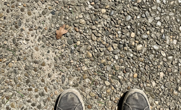 Close up of exposed aggregate concrete patio texture.