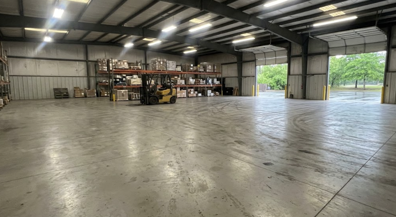 Heavy-duty industrial concrete floor inside a commercial warehouse