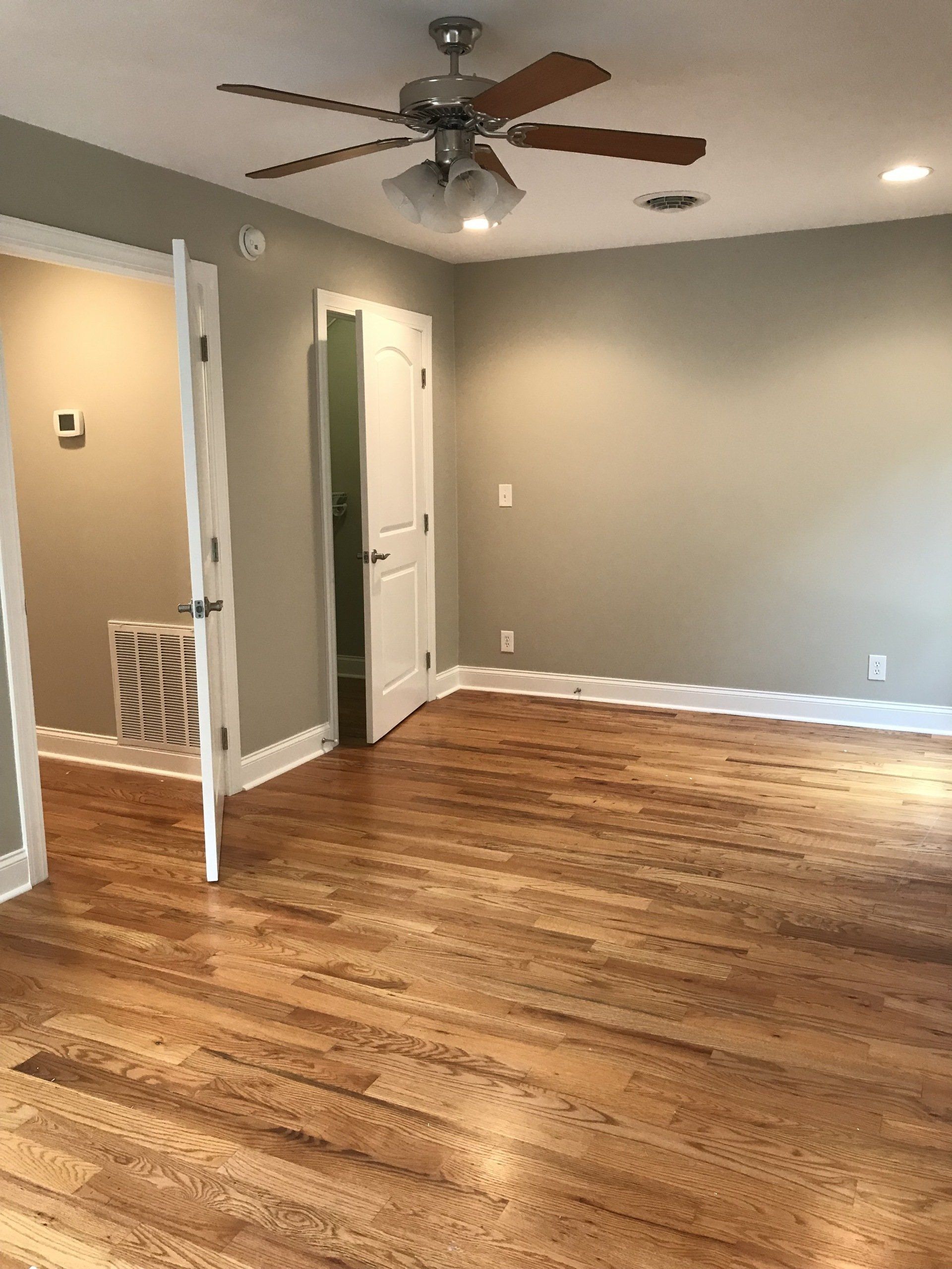 Living Room image showing hardwood floors, new ceiling fan, new outlets & crown molding