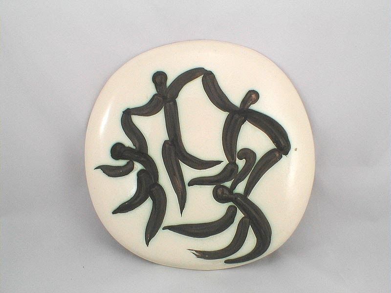 White circular disk with black abstract swirl design