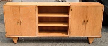 Mid-century wooden cabinet with two side doors and open center shelves on tapered legs