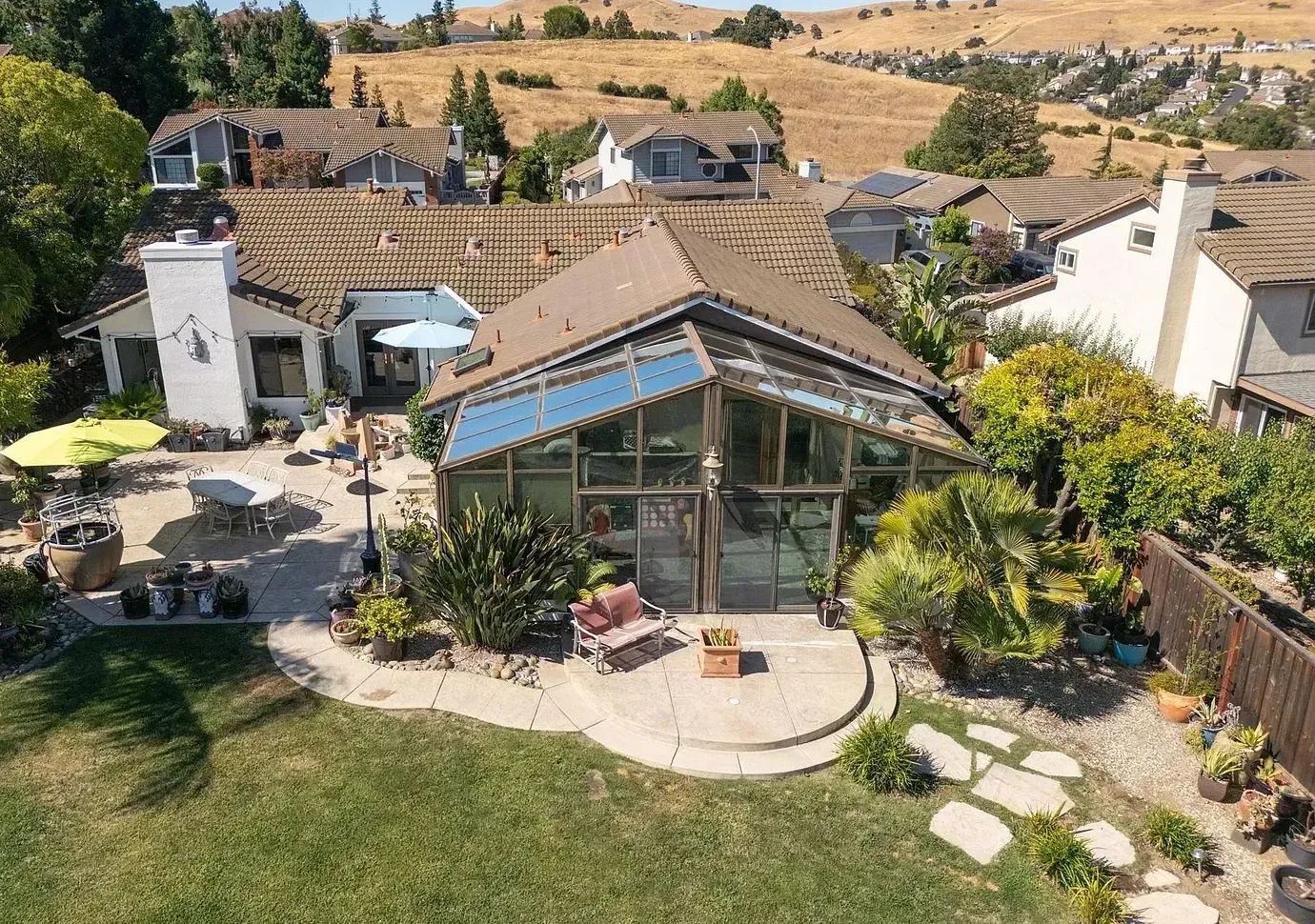 An aerial view of a house with a lot of windows