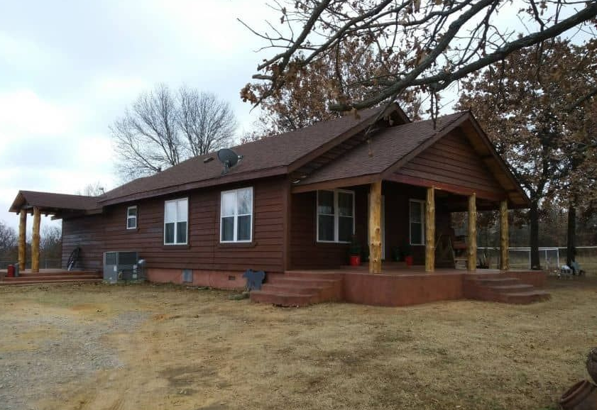 Completed siding replacement on an Oklahoma home with fresh paint