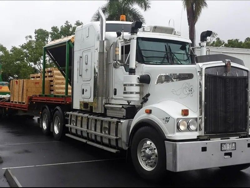 Delivery Man  In Front of a White Van — Trusted Carrier in Rockhampton & Gladstone, QLD