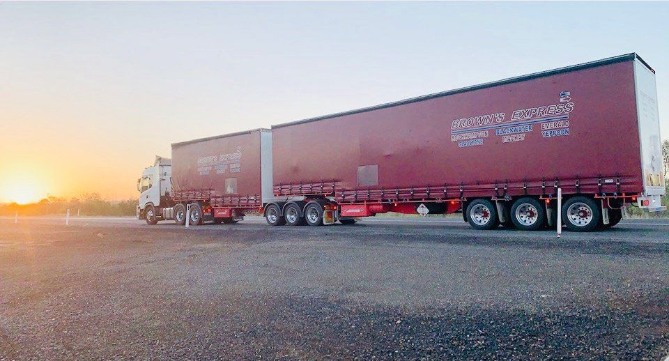 Hand on a Steering Wheel— Trusted Carrier in Rockhampton & Gladstone, QLD