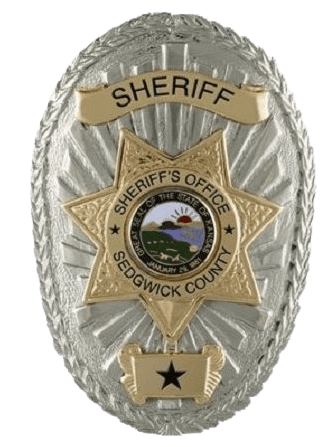 A sheriff 's badge from sedgwick county is shown on a white background.