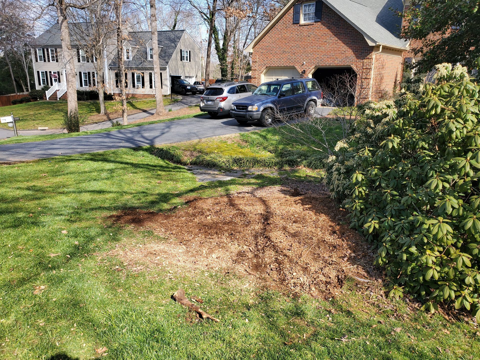 After Grinding a stump in a flower bed.