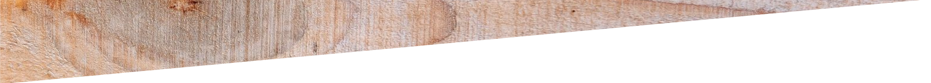 Close-up of a tan textured surface with a thin gray strip along the bottom edge
