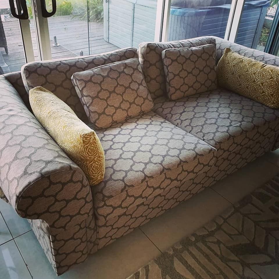 A Patterned Gray and White Sofa With Yellow Accent Pillows — McCormick Upholstery In Coolum Beach, QLD