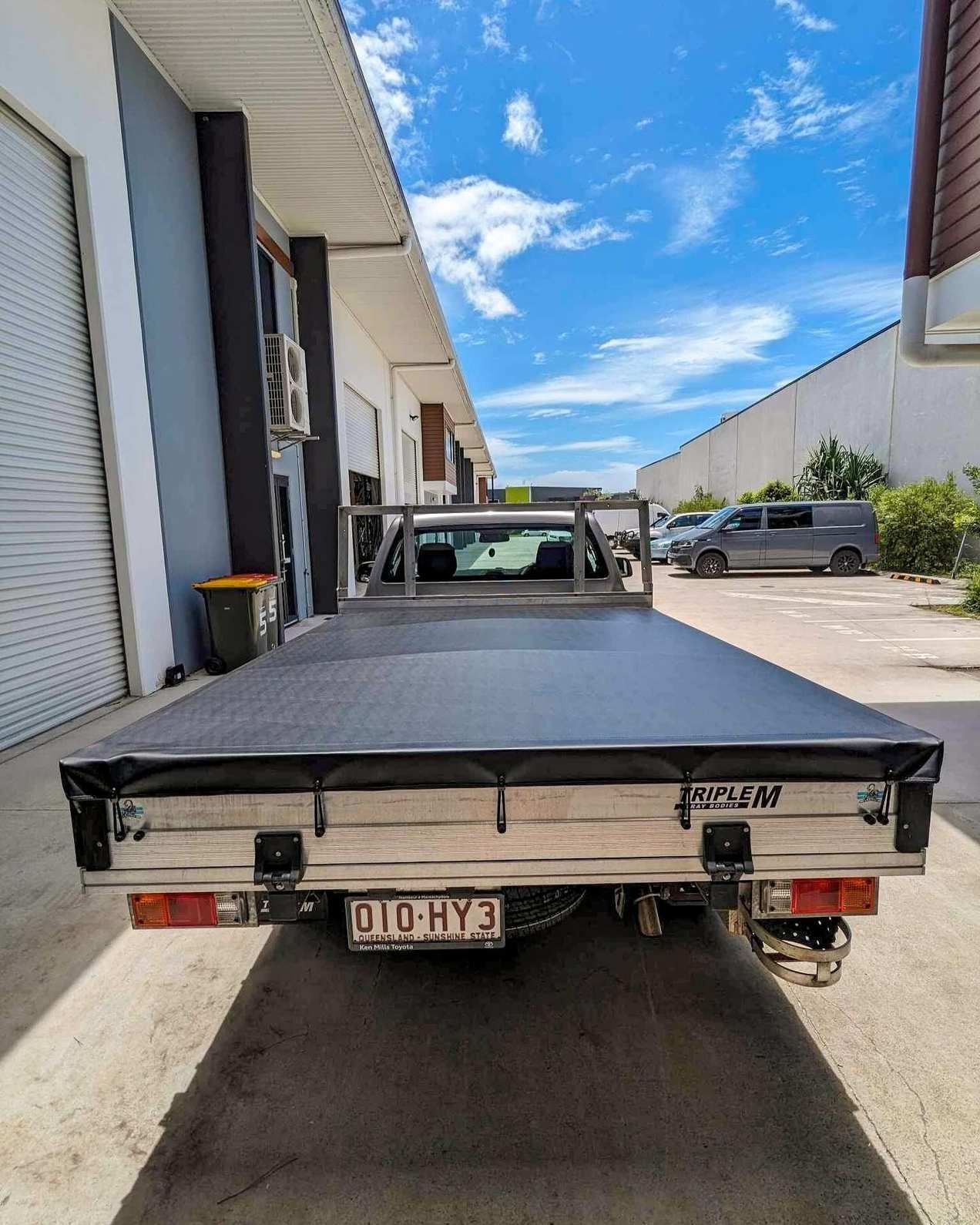 Interior of a Caravan With Gray Seating, White Walls, and a Built-in Kitchen — McCormick Upholstery In Coolum Beach, QLD