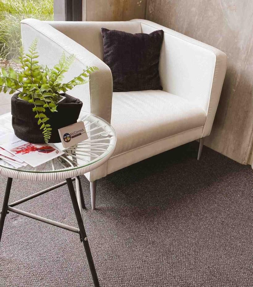 A White Armchair With a Dark Pillow — McCormick Upholstery In Coolum Beach, QLD