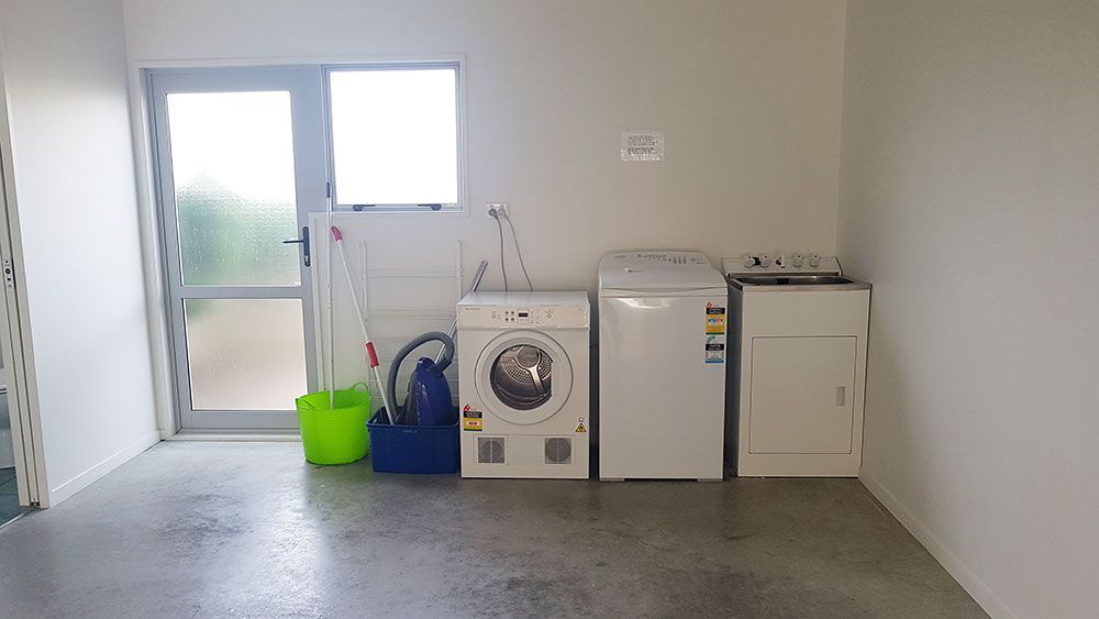 A laundry room with a washing machine and dryer