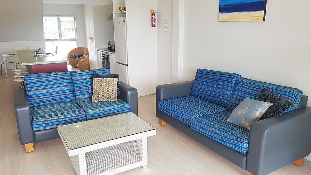 A living room with two couches and a coffee table.