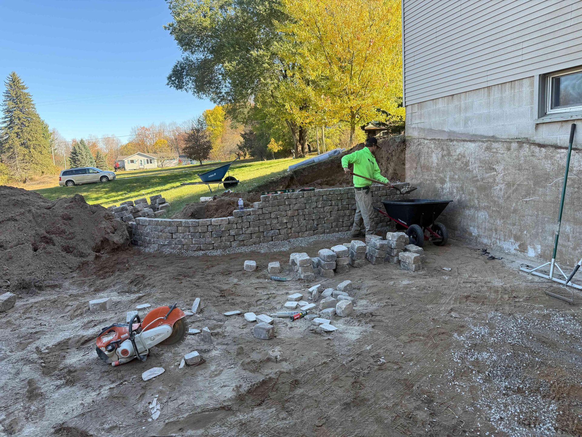 A brick wall with a garden in the middle of it