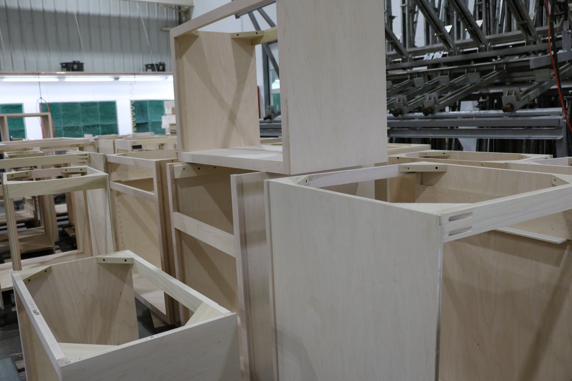 A bunch of wooden cabinets are stacked on top of each other.