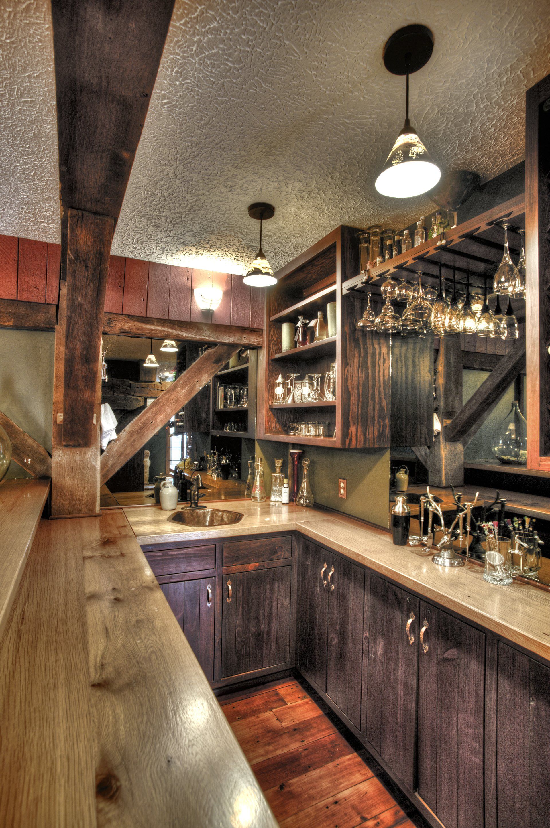 A kitchen with wooden cabinets and a wine rack.