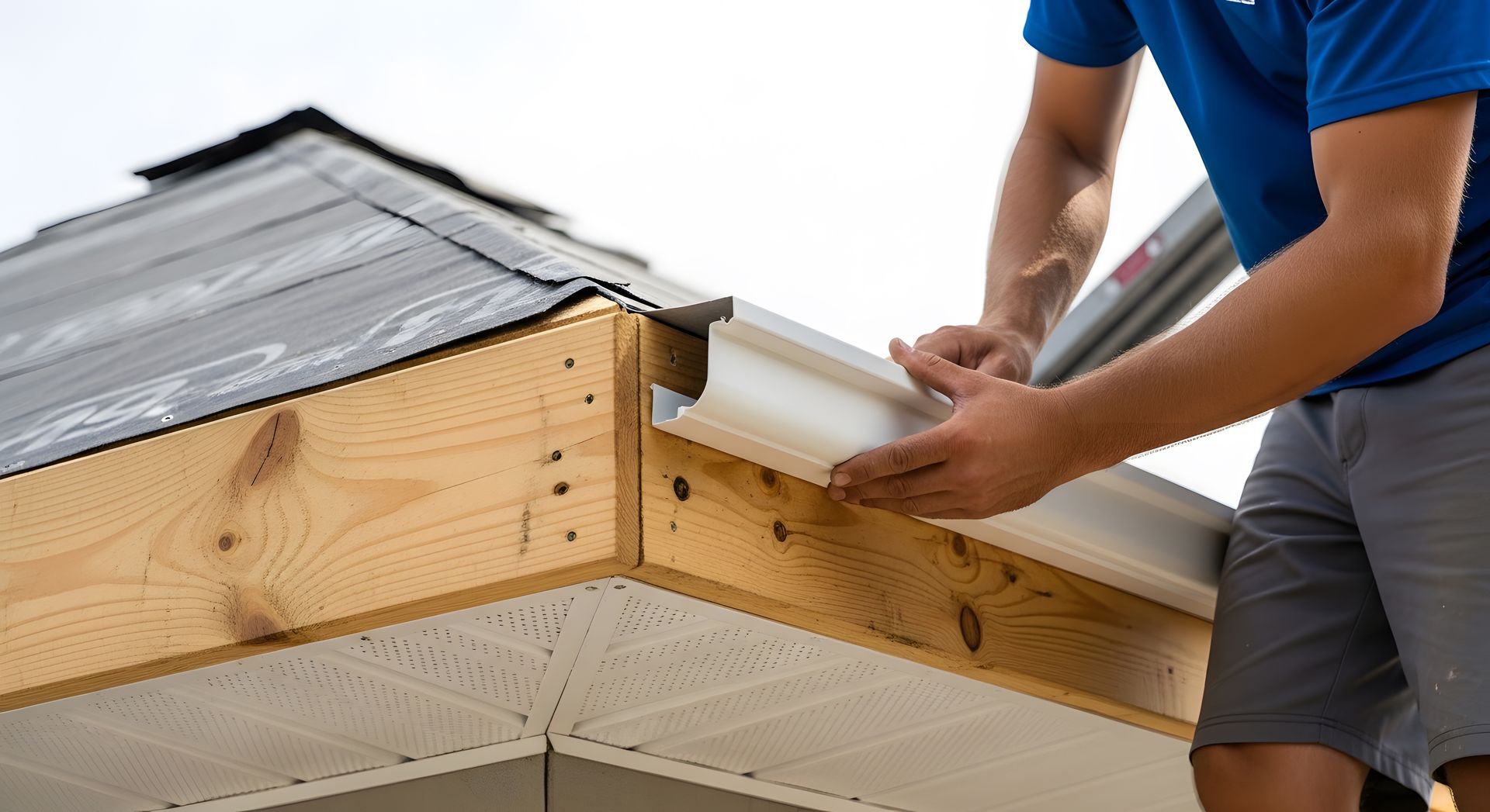 Gutter replacement contractor installing new seamless gutters home