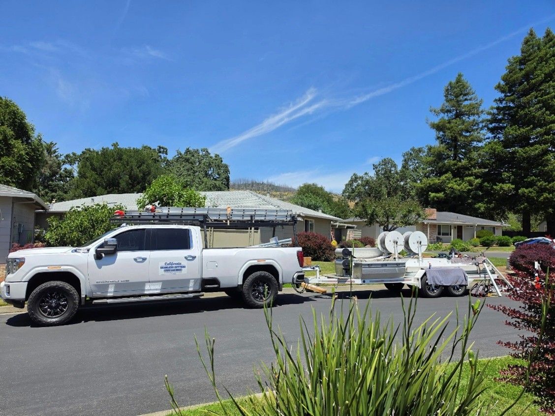 California Seamless Gutters truck and trailer at residential gutter installation job site