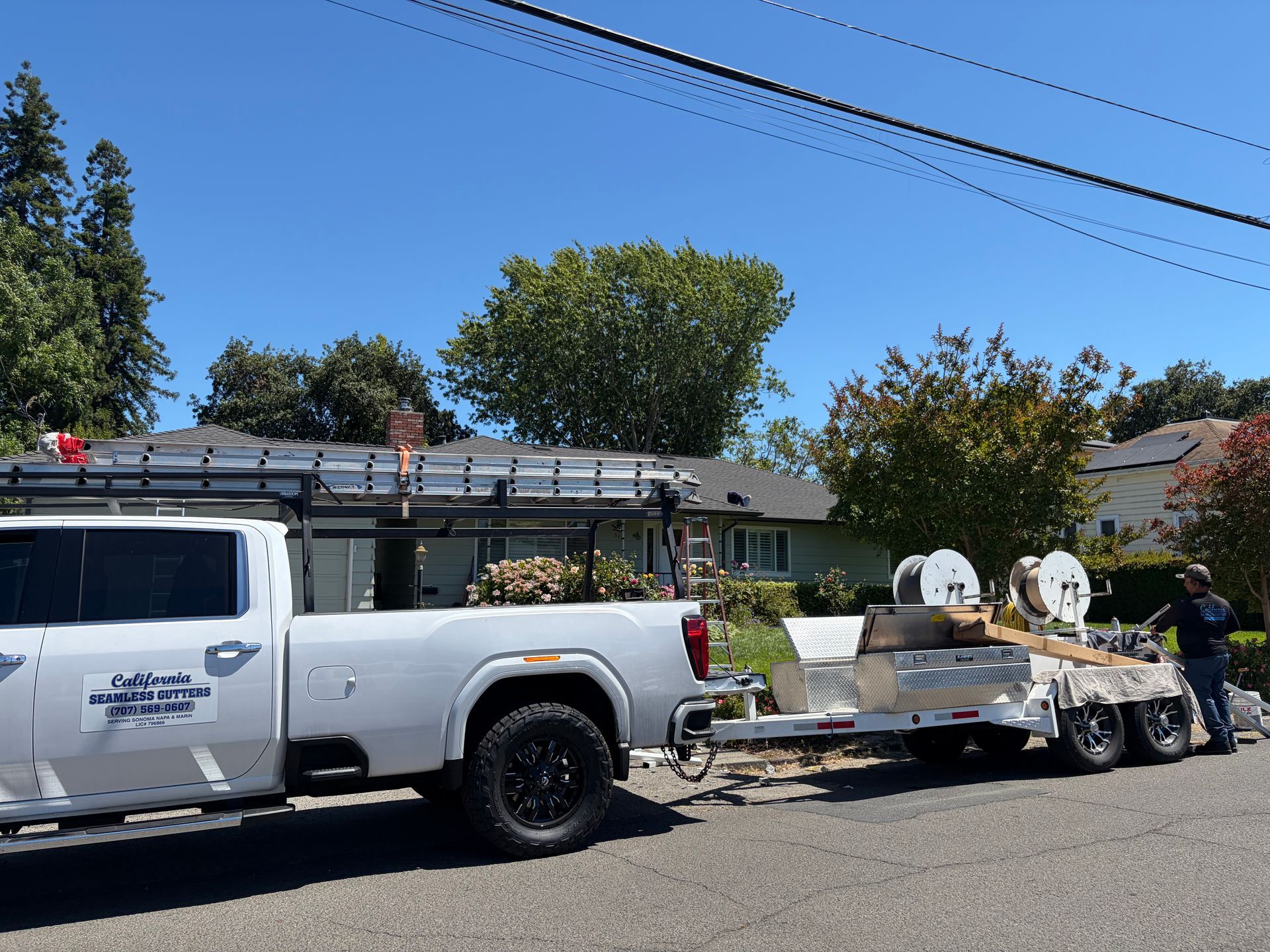 California Seamless Gutters work truck and trailer set up for a residential gutter installation.