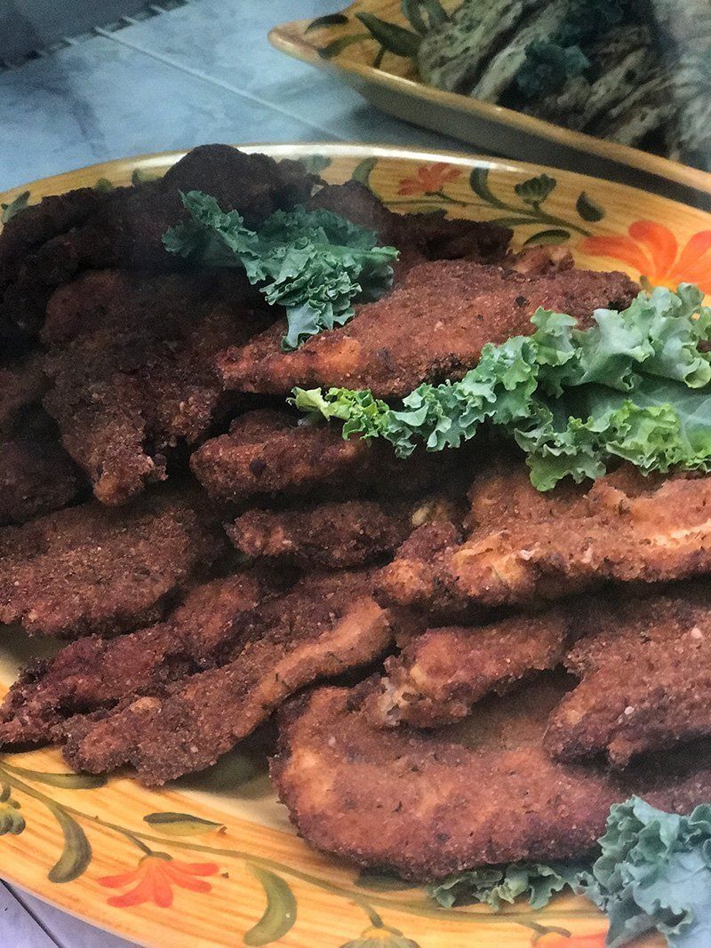Plate of fried meat cutlets garnished with fresh parsley
