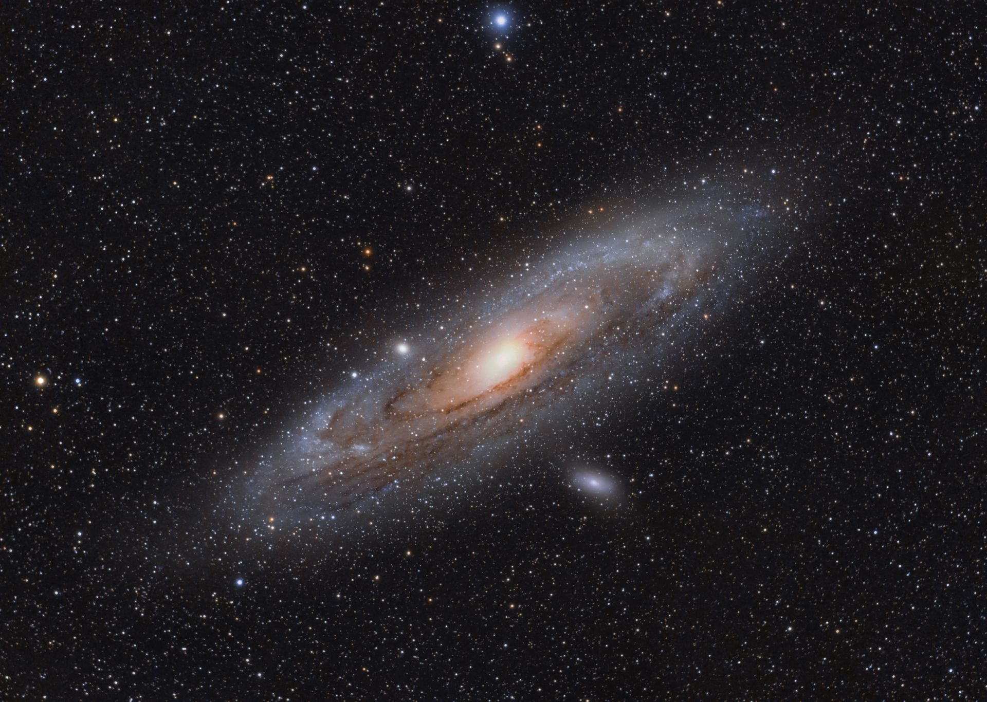 Spiral galaxy with bright core and scattered stars against a dark space background