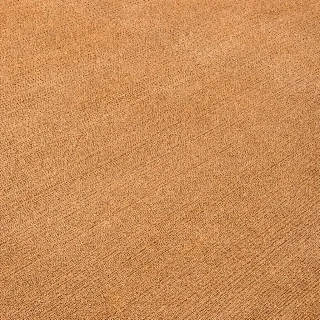 A close-up, top-down view of a textured, coloured concrete surface. Toowoomba Concreter.