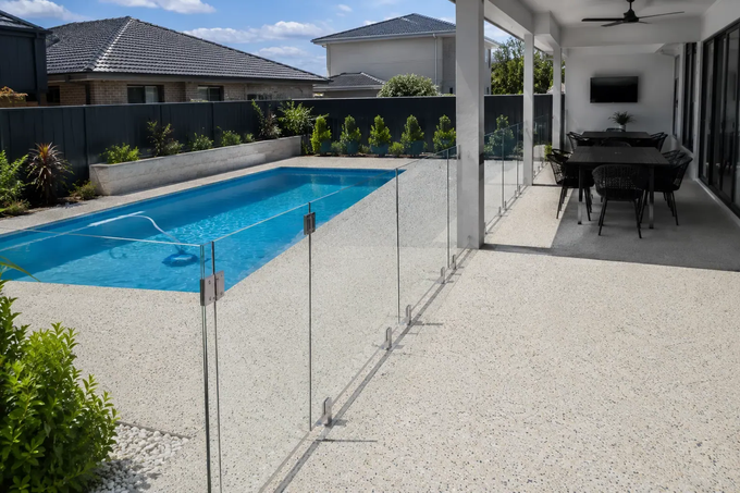 Exposed aggregate, concrete pool surround and patio area in Toowoomba 